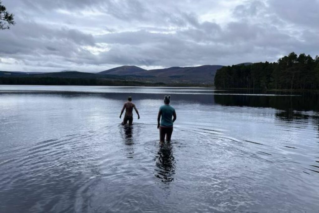 cold water therapy - leanne and antonia wading in a cold lake