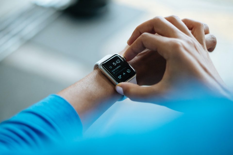 Man looking at apple watch small changes for health