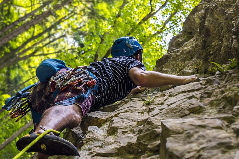 A rock climber climbing a rock