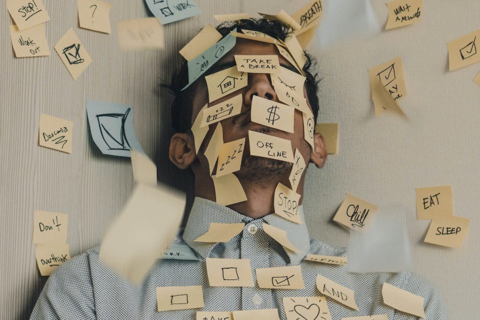 the effect of stress on the body man covered in post it notes